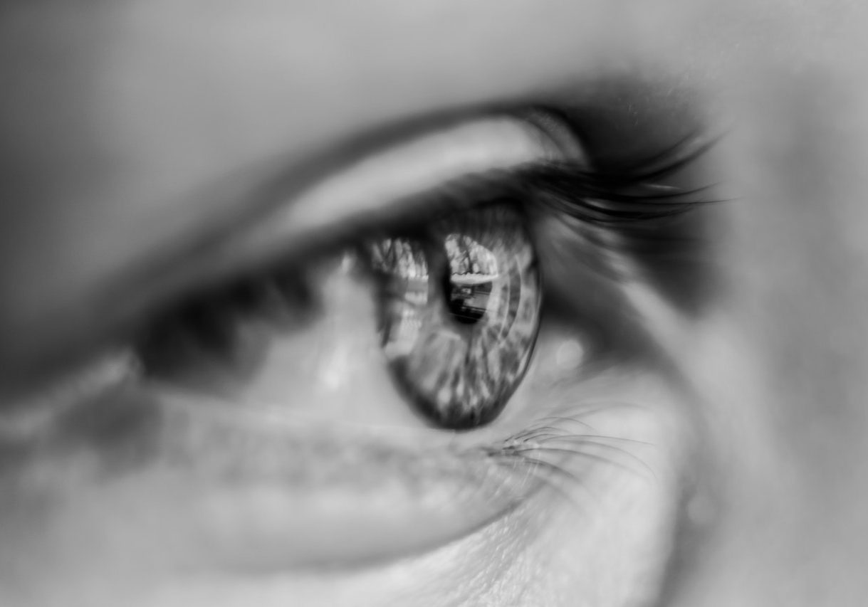 grayscale-macro-photography-of-person-s-eye-1047346-landscape