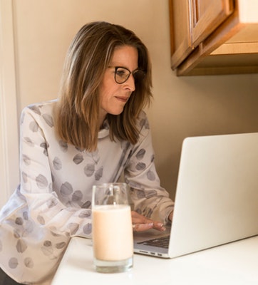 woman-using-gray-laptop-computer-in-kitchen-1251833